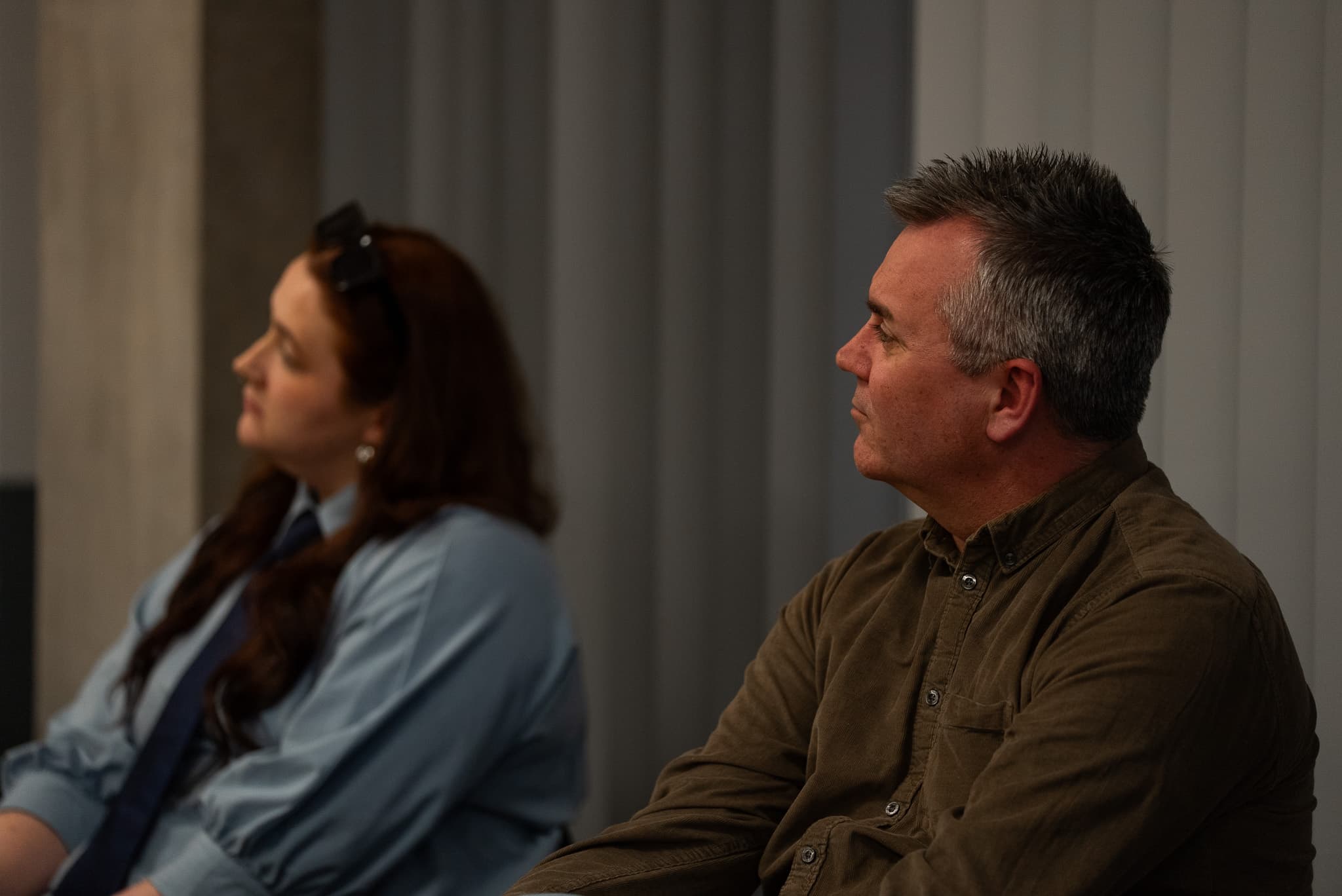 Two participants listening during an AI-readiness workshop